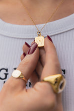 Load image into Gallery viewer, Dainty Thrills gold necklace with a dainty pendant featuring a red gemstone worn by a Gillian Magee the Founder. 
